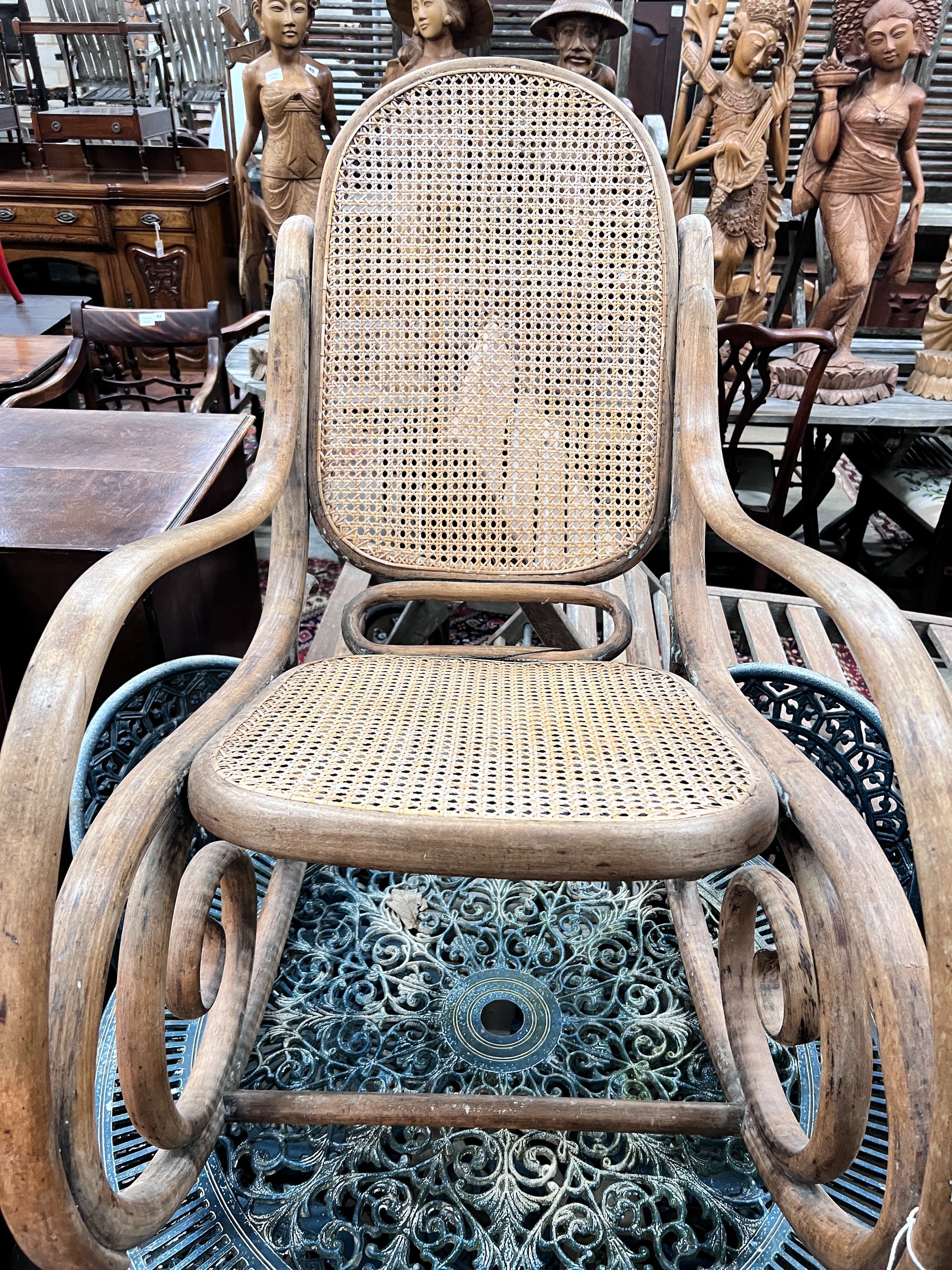 A caned bentwood rocking chair, width 52cm, height 88cm *Please note the sale commences at 9am.